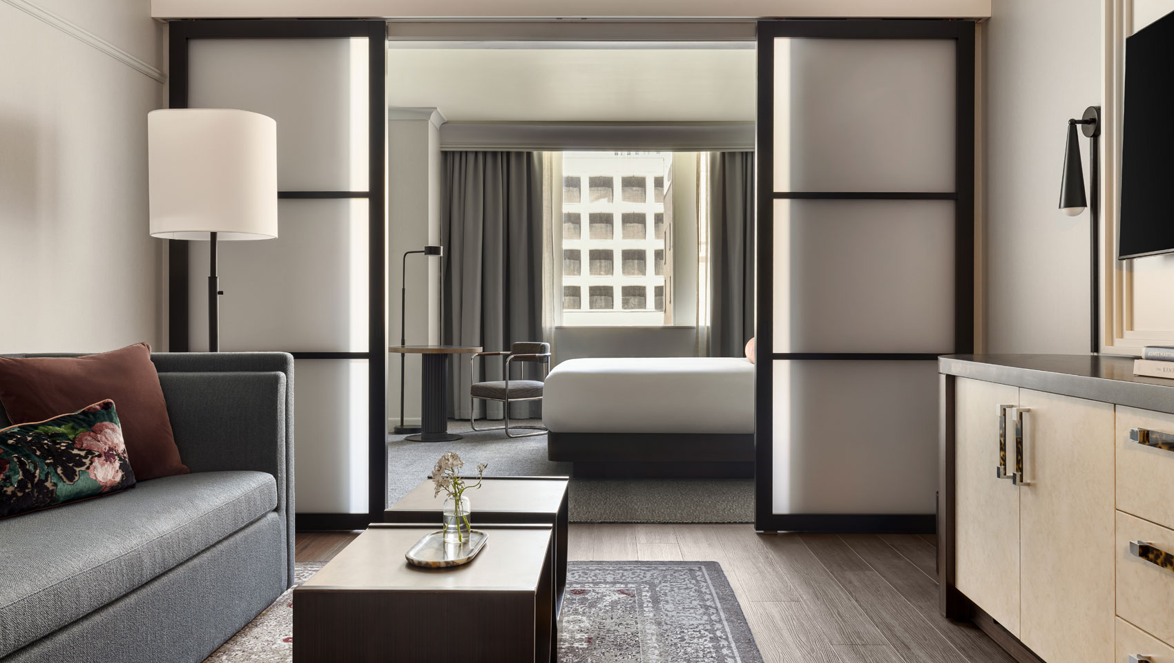 suite with view of bedroom and sitting area at Kimpton Hotel Monaco Seattle