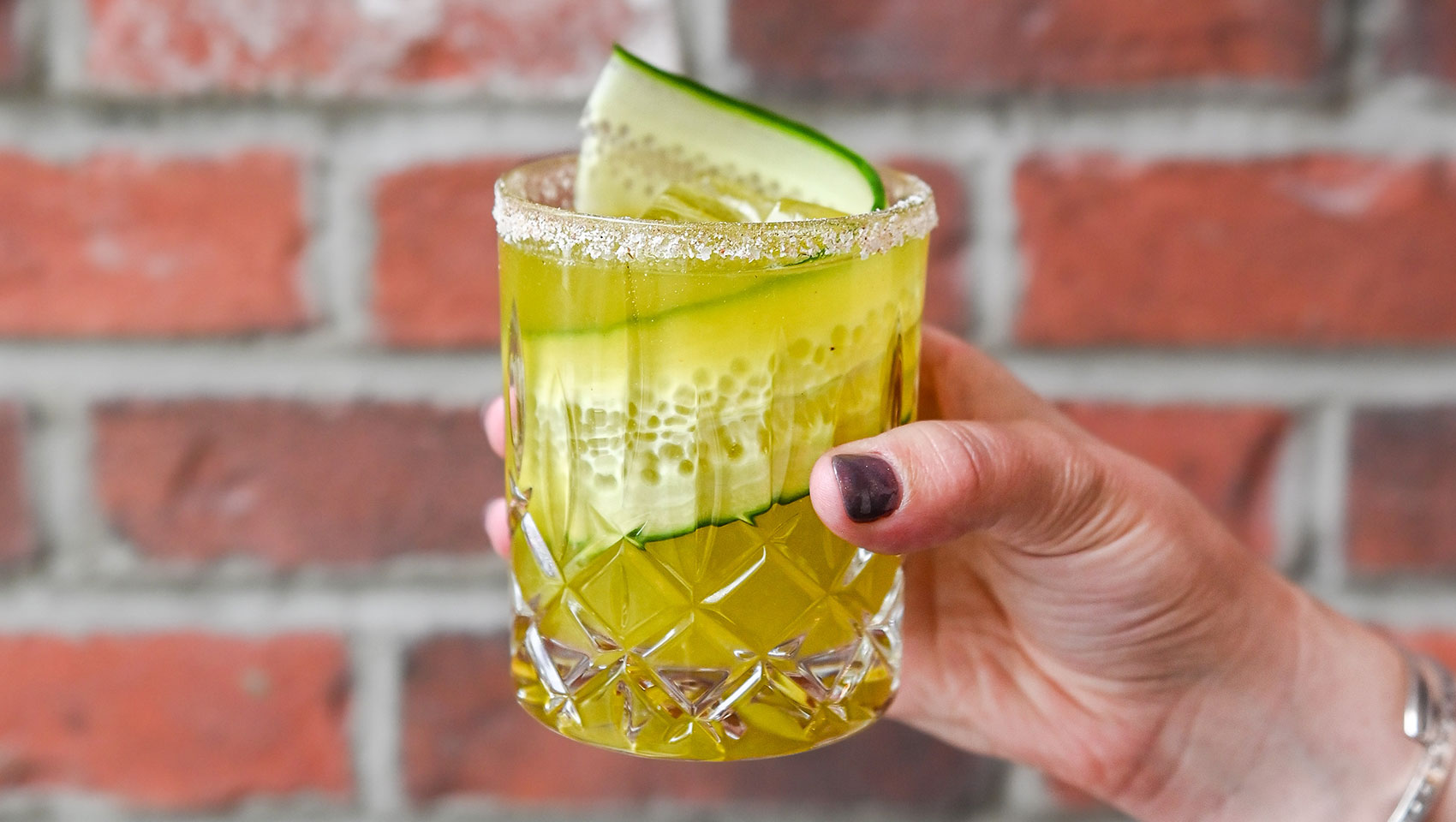 Yellow Marin cocktail with cucumber ribbon