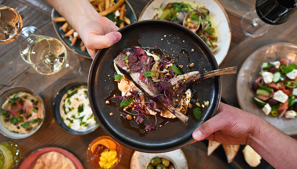 hands passing a dish at Marin