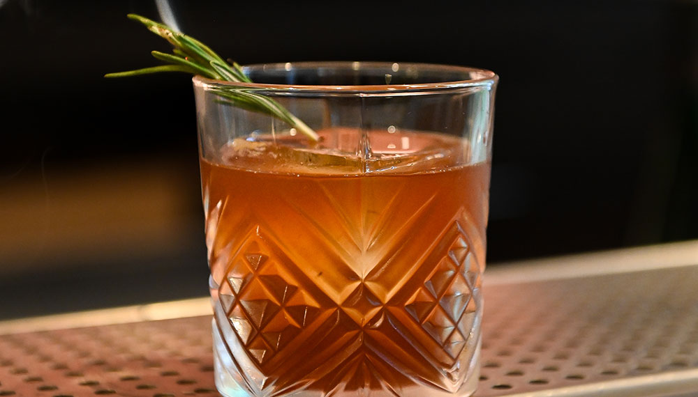 A smoking rosemary cocktail at Marin